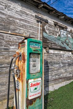 an old gas pump sitting in front of a building