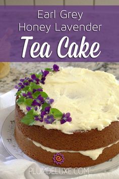 a cake with white frosting and purple flowers on top that says, eat grey honey lavender tea cake