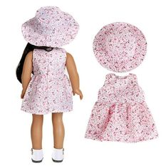 a doll with a dress and hat on it's head next to a doll