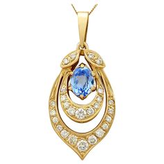 A fine and impressive 1.10 carat aquamarine and 0.92 carat diamond, 18 karat yellow gold pendant; part of our diverse vintage jewelry and estate jewelry collections. This fine and impressive oval cut pendant has been crafted in 18k yellow gold. The pendant has a pierced decorated, concentric tear-drop shaped frame accented with a paired leaf design to the upper border. A feature six claw / prong set 1.10Ct oval cut aquamarine ornaments the center of the arrangement. The pendant is embellished with a total of twenty-six pavé set modern brilliant round cut diamonds, graduating in size depending on their position within the design. The aquamarine pendant suspends from a contemporary 18k yellow gold 18" fine link curb chain via an integrated, flared ring loop attachment to the upper border of Gold Pen, Aquamarine Pendant, Yellow Gold Pendants, Watch Necklace, Vintage Diamond, Vintage Jewellery, Leaf Design, Estate Jewelry, Jewelry Ideas