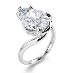 A stunning simple pear cut engagement ring, a masterpiece of shimmering silver metal that radiates an aura of love and commitment. At its heart, a magnificent pear cut gemstone stands tall, a pristine white symbol of pure affection, gleaming like a beacon of joy, ready to illuminate the path of a lifelong union. Crafted with meticulous attention to detail. This twist solitaire engagement ring effortlessly blends classic and contemporary elements, making it a versatile accessory for any occasion.Carat Weight: 10.37 ctStone Size: 10*15 mmStone Type: Jeulia® StoneNumber of Stones: 1 Stone Color: Diamond WhiteStone Shape: PearWeight: 5 gWidth: 2.1 mmHeight: 8 mmThickness: 1.3 mmMaterial: 925 SilverPlating Color: Silver White Gold Teardrop Jewelry For Proposal, Teardrop Brilliant Cut Proposal Ring, Teardrop Diamond Ring With Single Diamond For Anniversary, Teardrop Single Diamond Promise Ring, Teardrop Diamond Ring For Proposal, Luxury Silver Teardrop Diamond Ring, Formal White Pear-shaped Diamond Ring, Teardrop White Gold Diamond Ring Fine Jewelry, Diamond White Solitaire Teardrop Ring