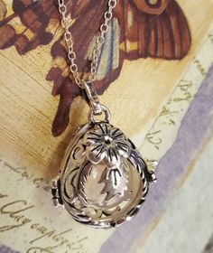 Floral Teardrop Locket w/ Fillable Glass by Thoughtfullkeepsakes Silver Birth Flower Jewelry Keepsake, Silver Jewelry With Birth Flower For Keepsake, Silver Locket Necklace With Birth Flower Round Pendant, Silver Locket Necklace With Birth Flower Gift, Clear Vintage Jewelry For Gifts, Silver Birth Flower Locket Necklace For Mother's Day, Silver Locket Necklace With Birth Flower For Mother's Day, Cremation Jewelry Necklaces, Glass Orb