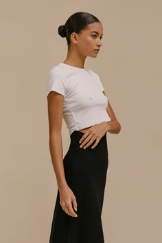 The perfect high waist pant companion. The Kelly Crop Slim Fit Tee is a nostalgic silhouette cut in our anything-but-basic cotton rib. Featuring a crew neckline, a just right cropped length, and clean, tailored finishing. Fitted High Waist Tops For Workwear, Chic Everyday Crew Neck Crop Top, Fitted Cropped Shirt For Work, Classic Fitted Tops With Straight Hem, Fitted Cropped T-shirt With Crew Neck, Fitted Cropped T-shirt With Crew Neck For Everyday, Versatile Fitted Crew Neck Crop Top, Fitted Crew Neck Crop Top, Basic Solid Color Fitted Cropped T-shirt