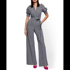 New York & Company Gingham Jumpsuit. Bell Bottoms, Puff Sleeves, Belted Waist, Back Zip. Side Slip Pockets, Pintuck Pleated Bust. Size Small. Measurements Laying Flat Are 19" From Pit To Pit, 15" Across The Waist, 18" Across The Hips, 13.5" Bottom Leg Opening And 59" From Shoulder To Bottom. I Am Wearing It And I Am 5'4" And It Is Slightly Long. New With Tags. Original Retail $89.95. Feels So Sexy On. Chic Summer Gingham Jumpsuit, Spring Fitted Gingham Jumpsuits And Rompers, Fitted Gingham Jumpsuits And Rompers For Spring, Chic Summer Plaid Jumpsuits And Rompers, Chic Plaid Jumpsuit For Summer, Chic Plaid Jumpsuits And Rompers For Summer, Gingham Jumpsuit, Pin Tucks, Bell Bottoms