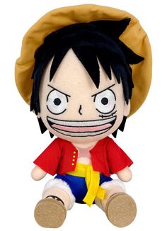 a stuffed doll with black hair wearing a red shirt and yellow hat