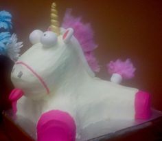 there is a cake shaped like a unicorn