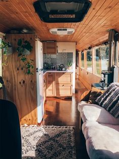 the interior of a tiny home with wood paneling