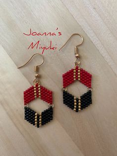 a pair of earrings made out of legos