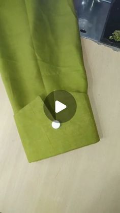 a green bag sitting on top of a table