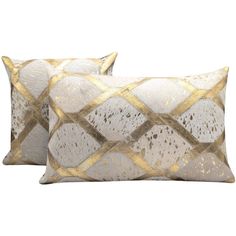 two pillows with gold and white designs on them, one in the shape of a diamond