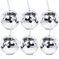 six silver balls with straws in them on a white background