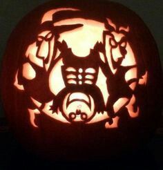 a carved pumpkin with an image of cats on it