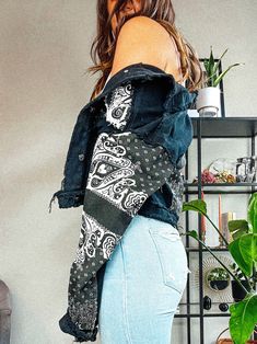 Keep it cool in this oversized bandana print denim jacket! - Chic distressed denim jacket featuring a medium weight denim with a collared neckline, long sleeves with buttoning cuffs, twin flap pockets, and a full button placket. - Whiskering, and distressing accent the collar, shoulders cuffs and hem. - This is an oversized fit so we recommend sizing down for a more fitted feel. - Sleeves do run a bit long. - Model is 5’9” wearing a size Medium.- 85%Cotton 15%Polyester Band Outfits, Printed Denim Jacket, Keep It Cool, Print Denim, Diy Clothes Life Hacks, Distressed Denim Jacket, Black Denim Jacket, Bandana Print, Button Placket