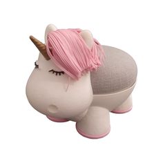 a white and pink toy with a unicorn's head on it