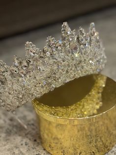 there is a gold container with some diamonds in it