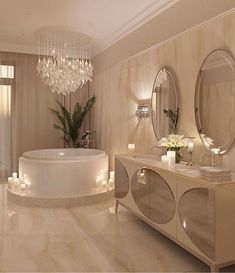 an elegant bathroom with chandelier, bathtub and candles