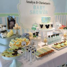 a table topped with lots of cakes and desserts