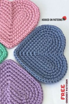 four crocheted hearts sitting on top of each other