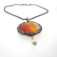 "From Porans collection ----> Unique Silver Pendant, amazing big natural Carnelian, 1 pearl hanging. Pendant Dimensions: Max Length: 78 mm\\ 3.12 inches Max Width: 38 mm\\ 1.52 inches The length of the chain is usually 18\" - 22\",  yet can be made at any size you wish, if you are interested in a specific length, Please! write a note on check out Please note - stone (carnelian) will be similar to the stone in the picture but can't be the same...  An amazing gift for yourself or loved ones!  Come Elegant Carnelian Round Pendant Jewelry, Elegant Carnelian Necklace With Large Pendant, Bohemian Style Jewelry With Round Pearl Pendant, Silver Carnelian Pendant Necklace, Unique Round Pearl Pendant Jewelry, Unique Pearl Pendant Jewelry, Bohemian Style Round Pearl Pendant, Elegant Carnelian Round Pendant Necklace, Elegant Carnelian Jewelry With Large Pendant