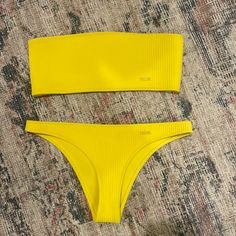 Super Cute Yellow Triangl Bikini In Brand New Condition Yellow Seamless Swimwear For Beach Season, Yellow Strapless Swimwear For Poolside, Yellow Stretch Swimwear For Sunbathing, Yellow Bandeau Swimwear For Summer, Yellow Seamless Swimwear For Poolside, Yellow Strapless Beachwear Swimwear, Yellow Seamless Swimwear For Spring, Yellow Stretch Seamless Swimwear, Yellow Seamless Stretch Swimwear