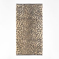 an animal print rug on a white background