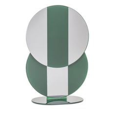 two plates stacked on top of each other in green and white striped design, one with an oval base