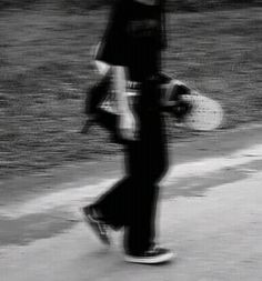 black and white photograph of a person on a skateboard