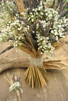 a bunch of flowers sitting on top of a wooden table