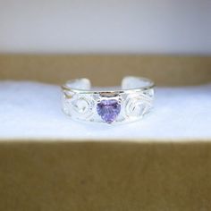 Hawaiian 925K Sterling Silver Purple Heart CZ Toe Ring All toe ring comes with a gift box. Weight: 1.5g Quantity: 1 Toe Ring Hawaiian Design, Heart Purple, Hawaiian Designs, Toe Ring, Purple Stones, Purple Heart, Toe Rings, Hawaii, Handmade Items