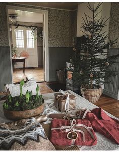 a living room filled with furniture and a christmas tree