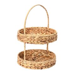 two tiered wicker basket with handles on each side, one holding a handle