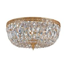 a large crystal flush light fixture with gold trim