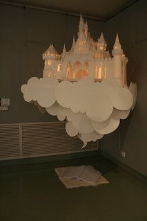 a chandelier hanging from the ceiling in a room with a castle on it