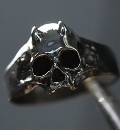 Skull ring Devil mini Material: Sterling Silver 925 Please note that actual colors may vary slightly from their appearance on screen. For more information, please visit my shop policies. If you have any questions, please do not hesitate to contact me. Delivery of the world Adjustable Skull Rings With Symbolic Style, Black Symbolic Skull Ring For Halloween, Symbolic Skull Rings For Halloween, Symbolic Black Skull Ring For Halloween, Halloween Skull Rings Symbolic Style, Adjustable Sterling Silver Skull Ring, Punk Skull Rings As Gift, Adjustable Symbolic Skull Ring, Gothic Sterling Silver Rings With Skull Print