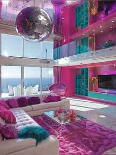 a living room filled with lots of furniture and a disco ball hanging from the ceiling