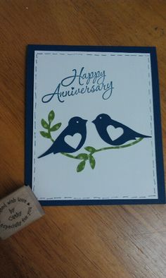 an anniversary card with two birds on a branch