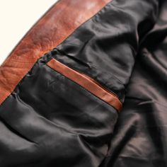 Embrace the spirit of adventure with the Teton Leather Jacket, a tribute to the rugged majesty of Wyoming’s Teton Mountain Range. Its rich, full-grain leather evokes the grandeur of these storied peaks, making a statement that is both daring and refined—striking the perfect balance between boldness and restraint. Crafted from premium full-grain sheep leather that develops a handsome patina with wear, the jacket features a modern brick-stitch pattern for a contemporary update. The lightweight dow Rugged Brown Leather Jacket With Leather Lining, Classic Brown Biker Jacket For Outdoor, Rugged Leather Jacket With Leather Lining, Cognac Leather Winter Outerwear, Outdoor Brown Leather Jacket, Cognac Leather Outerwear For Winter, Brown Leather Jacket For Outdoor Use, Leather Jacket With Double-needle Stitching For Fall Outdoor, Brown Winter Outerwear For Adventure