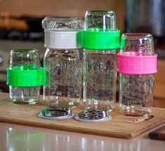 the jars are lined up on the cutting board