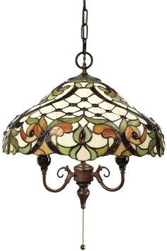 a stained glass lamp hanging from a chandelier