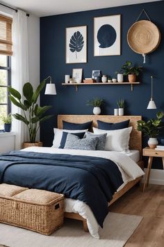 a bedroom with dark blue walls and white bedding, wicker baskets on the floor