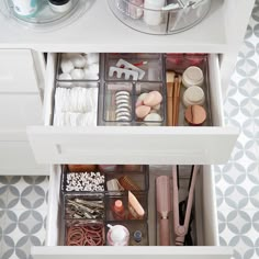 the drawers are organized with makeup and other items