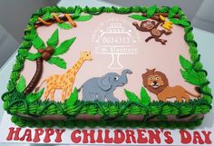 a birthday cake with jungle animals and monkeys on the top is for children's day