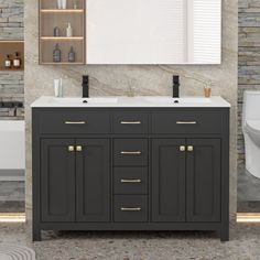 a bathroom vanity with two sinks and a large mirror above it, next to a toilet