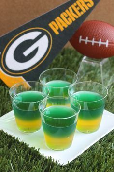 green and yellow jello shots on a football field