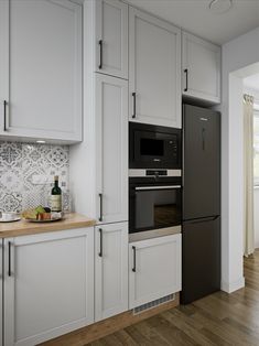 a kitchen with white cabinets and stainless steel appliances