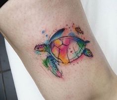 a colorful turtle tattoo on the leg