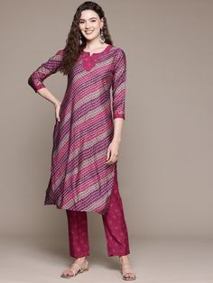 Leheriya Printed Pure Silk Kurta With Trousers PRODUCT DETAILS  Pink printed Kurta with Trousers Kurta design: Leheriya printed Straight shape Regular style Round neck, three-quarter regular sleeves 1 pockets Calf length with straight hem Pure silk machine weave fabric Trousers design: Printed Trousers Partially elasticated waistband Slip-on closure Size & Fit The model (height 5'8) is wearing a size S Material & Care Pure Silk Machine Wash Specifications Sleeve Length Three-Quarter Sleeves Top Leheriya Kurti, Three Quarter Sleeve Tops, Kurta Design, Silk Kurta, Printed Trousers, Sleeves Top, Kurta Designs, Top Pattern, Salwar Kameez