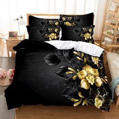 a bed with black and yellow flowers on it