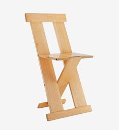 a wooden folding chair sitting up against a white background