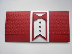 a red and white card with a bow tie on it